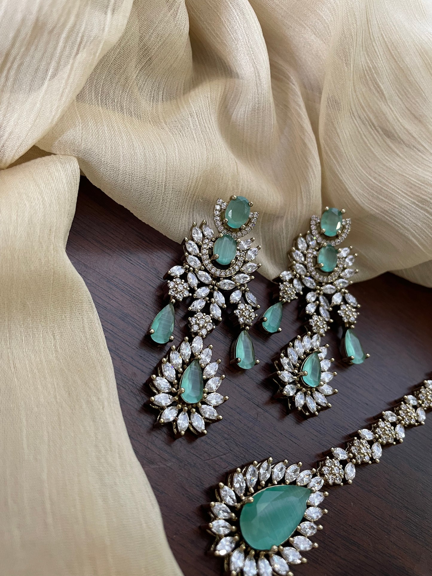 Premium Statement Ad Earring & Tikka Set - MINT
(Antique Gold Base)