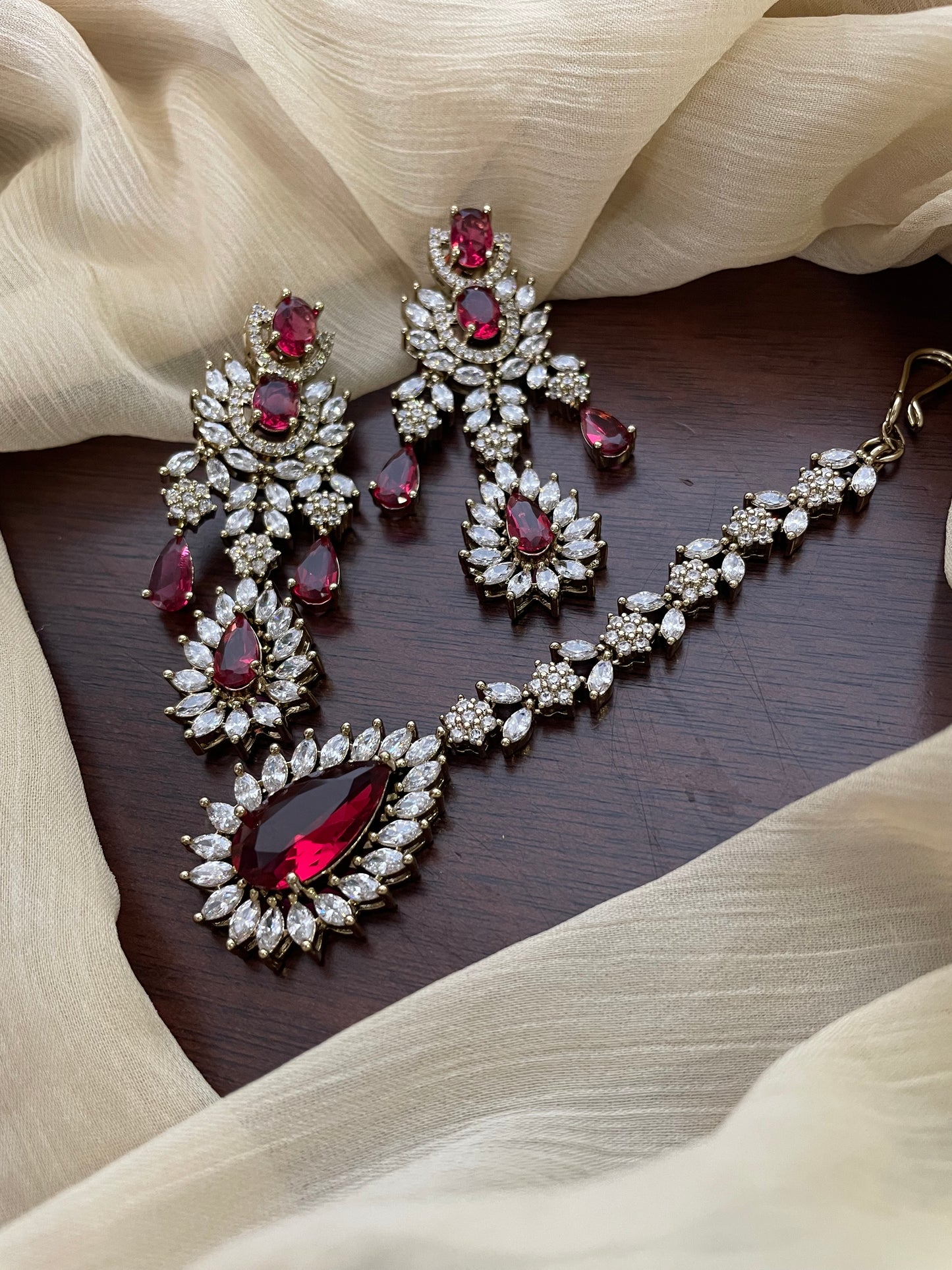 Premium Statement Ad Earring & Tikka Set - MAROON 
(Antique Gold Base)